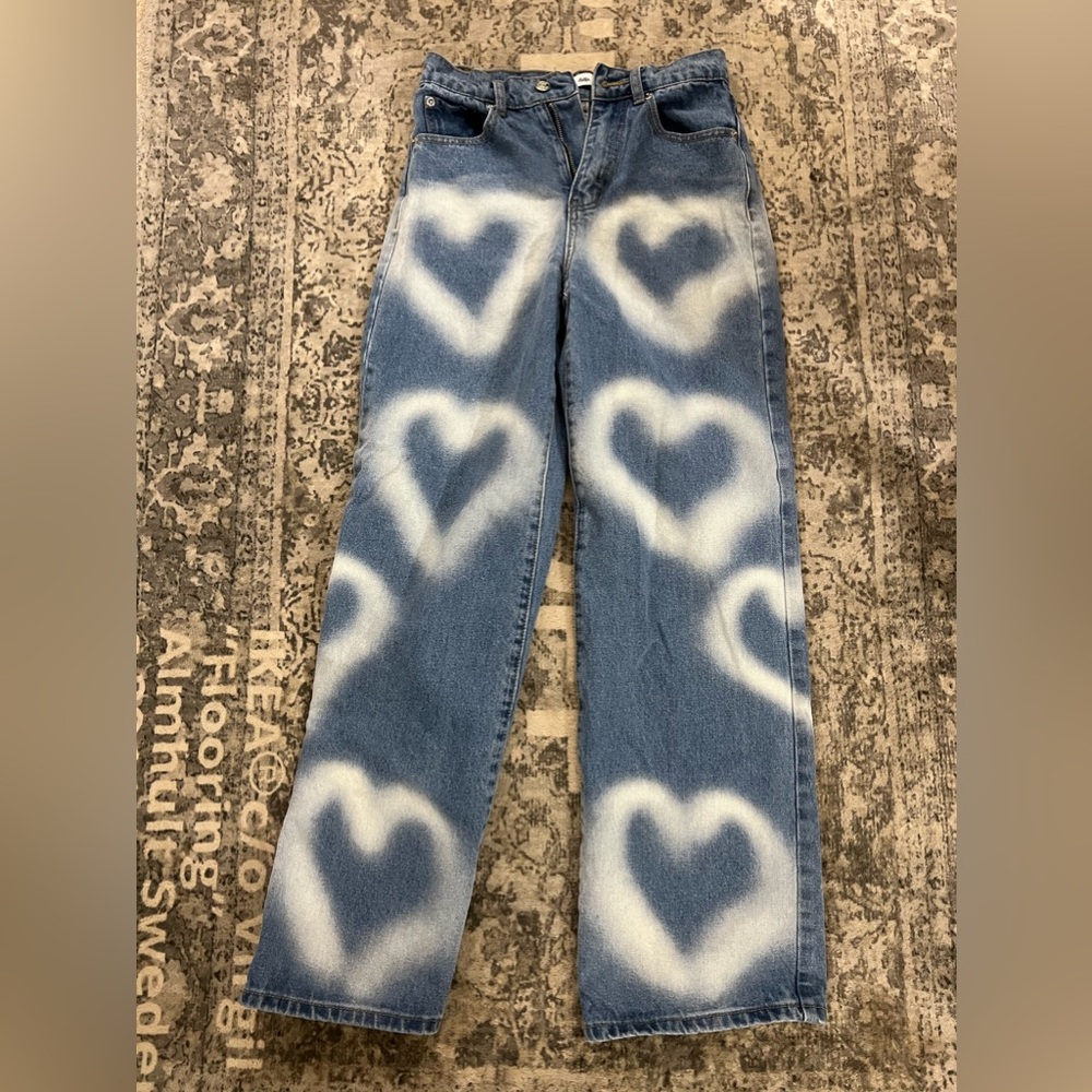 Blue and white heart jeans. Brand name is Adika. Size XS